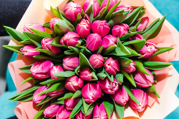 Spring bouquet of pink tulips . Bunch of many colorful fragrant flowers. Floristry and floral design concept. Floral texture