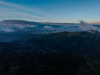 Beautiful aerial view of wind Mills - turbines- on Costa Rica’s hills at sunset, overlooking San...