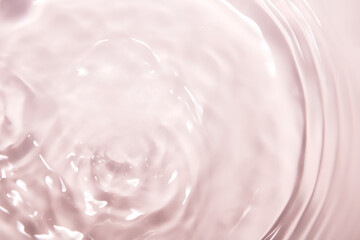 Soft Pink Water Surface with Gentle Ripples and Reflections