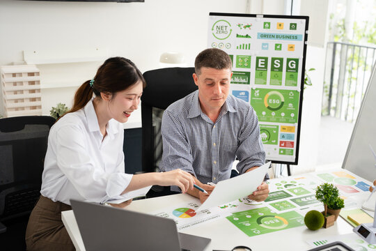 Businesspeople talk ESG strategies global warming, green finance and investment and net zero waste lifestyle.