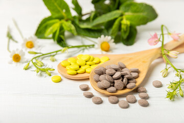 Alternative medicine herbal capsule organic drug on wooden background.Assortment of herbal and tablets,vitamins and dietary supplements.medicinal and Healing herbs.natural supplements for healthy life