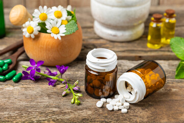 Alternative medicine herbal capsule organic drug on wooden background.Assortment of herbal and tablets,vitamins and dietary supplements.medicinal and Healing herbs.natural supplements for healthy life