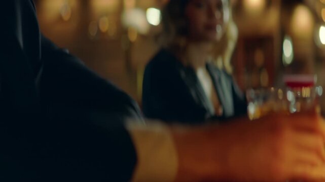 Beautiful Caucasian couple having a date in a stylish restaurant, talking and laughing. Shot with 2x anamorphic lens