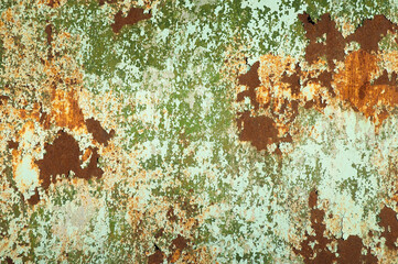 green brown background, in the photo an old iron wall with traces of paint and rust