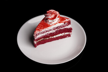 Delicious red velvet cake slice on white plate