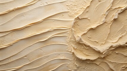 Photo of an abstract closeup of a textured beige surface with layered, wavy patterns and rough edges