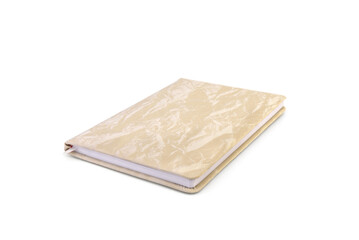 Beige notebook isolated on white background.