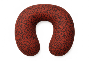 Red travel neck pillow with black dots, providing comfort and support for sleeping during journeys, isolated on transparent background