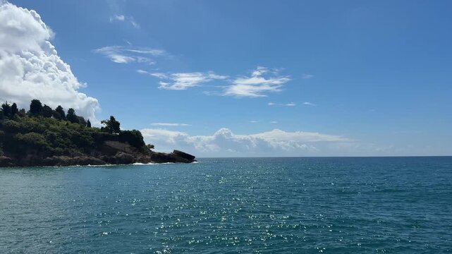 Mediterranean sea, blue sky and rocky coastline.