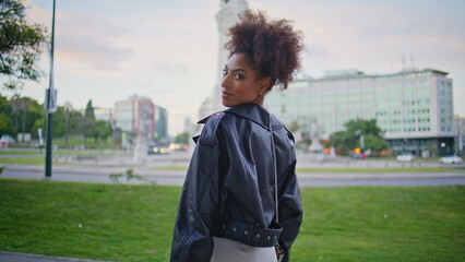 Stylish lady standing street enjoying urban weekend closeup. African woman