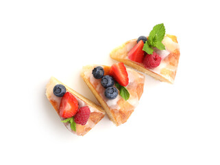 Pieces of delicious bundt cake with berries, glaze and mint isolated on white, top view