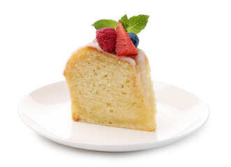 Piece of delicious bundt cake with berries, glaze and mint isolated on white