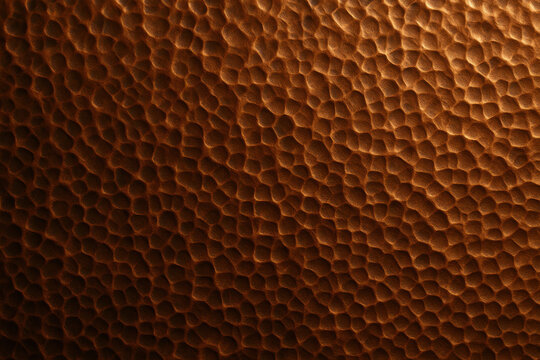 Textured Copper Surface: An abstract, high-resolution macro shot revealing the intricate textures and warm tones of a hammered copper surface, creating a sense of timeless elegance.