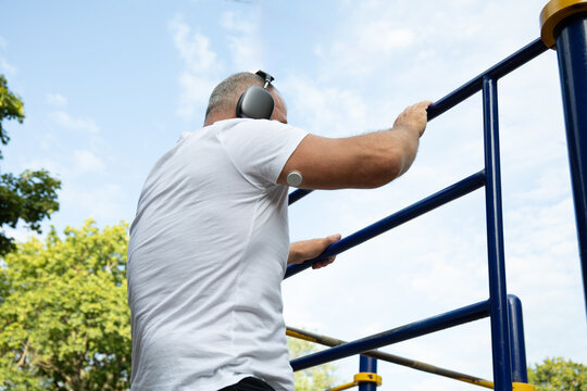 Man Training with Glucose Sensor and Headphones