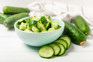 Cucumber on wooden background. Slice of cucumber on background. Fresh organic green cucumbers...