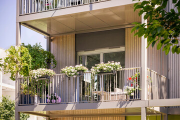 Modern Balcony of Modern Apartment Building with Balcony Flowers. Eco Facade Balcony Building.