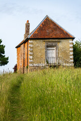 Obraz premium Historic Town Hall or meeting house on a quiet road in the charming village of Newtown, Isle of Wight