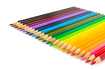 Colored pencils isolated on white background. Equipment for coloring. Stationery for creativity.Back to school. Flatlay. Children's Creativity and Education. Rainbow.