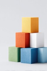 Obraz premium minimalistic arrangement with various colored blocks against plain white background include ample copy space