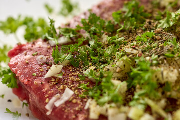 Raw Beef Steak with Herbs and Onions