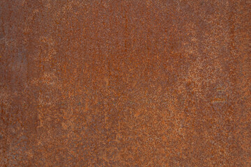 Close-up of rusty metal texture showing natural corrosion and weathered patterns. Image for backgrounds, industrial design projects, or creative concepts illustrating decay and aging surfaces.