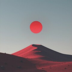 Red sun above a sand dune landscape with a clear and bright sky above it