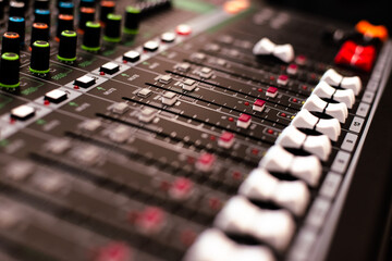 Mixing consoles are devices for creating high-quality sound. control of sound sources at concerts and holidays. Audio channel strips and frequency and volume control sections. High quality photo