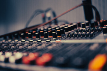 Mixing consoles are devices for creating high-quality sound. control of sound sources at concerts and holidays. Audio channel strips and frequency and volume control sections. High quality photo