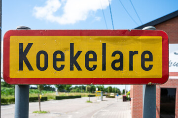 Road sign of the village of Koekelare, West Flanders, Belgium