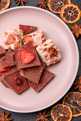 Bar sweet craft artisan chocolate with dried fruits made at home. Craft chocolate