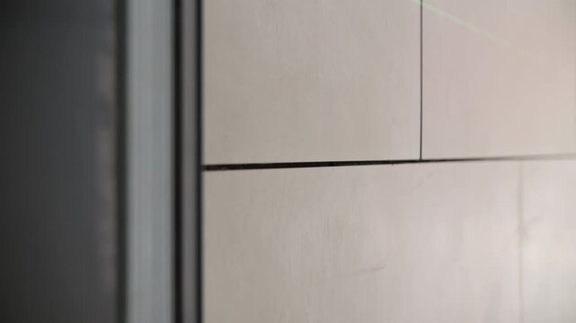 Wall with installed tiles and unfinished joints