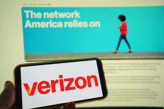 Roosendaal, The Netherlands - July 29, 2025: A mobile phone displaying the company logo of Verizon, with the company website in the background.