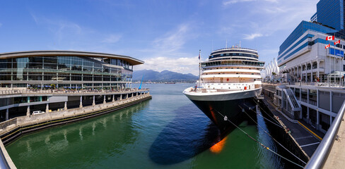 Cruise Ship Docked in Downtown Vancouver Harbor, Canada Under a Clear Blue Sky