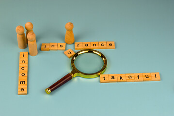 A magnifying glass examines the connection between income and insurance