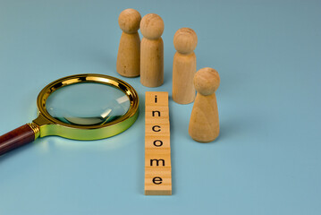 A magnifying glass examines the connection between income and insurance