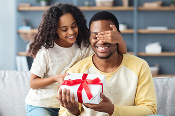 Father Day concept, sweet african american girl with curly hair greeting her daddy, daughter...