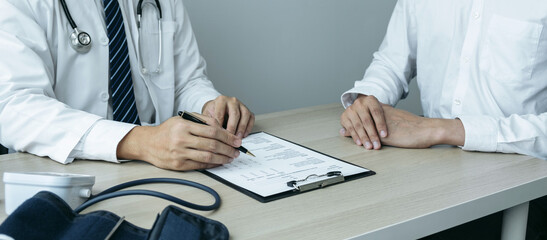 Doctor consulting with the patient and checking sickness condition while presenting results diagnosis symptom examining about the problem of illness and recommend treatment method