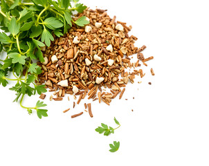 A top-down view of fresh green parsley herbs next to a pile of chopped mixed nuts, isolated on a white background with copy space.