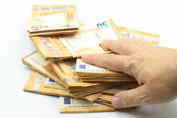 Robbery, corruption, a hand over bundles of 50 euro bills.