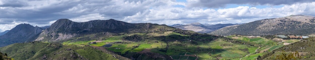 Fototapeta premium Scenic nature surrounds the hiking trails, offering stunning views and peaceful outdoor experiences in Sierra Tejeda Natural Park, Spain