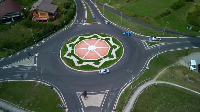 Palmanova. Aerial view of a roundabout featuring intricate landscaping and vibrant greenery, showcasing urban design and traffic flow in a modern city