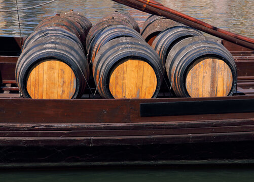 Portugal, Porto. Port wine barrels on a "rebelo" boat berthed on the River Douro.
