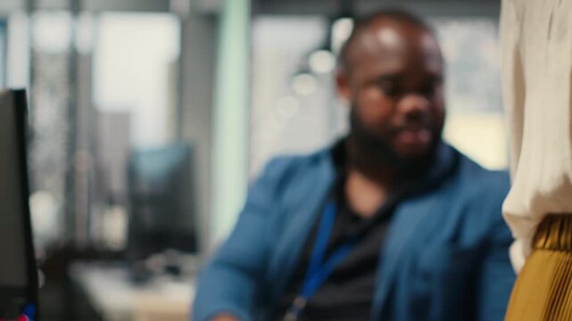 Close up of office secretary pushes a trolley filled with paperwork and documents, bringing files to a colleague and ensuring efficient distribution of resources. Workplace support. Camera B.
