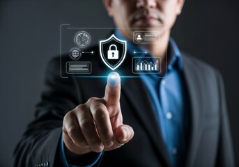 A businessman touches a futuristic holographic interface, activating a glowing security shield with a padlock icon to symbolize cybersecurity and data protection. Photorealistic.