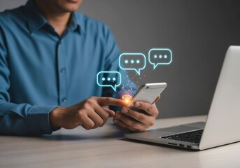 Obraz premium A man at his desk uses a smartphone, with glowing, futuristic chat bubbles emerging from the screen, symbolizing social media and mobile messaging. Photorealistic.