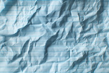 Obraz premium Crumpled Blue Paper Texture: A Creative Stationery Background with Abstract Artistic Lines and Folds