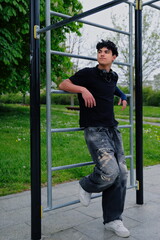 Young hispanic teenage guy portrait, stylish teenager outdoor