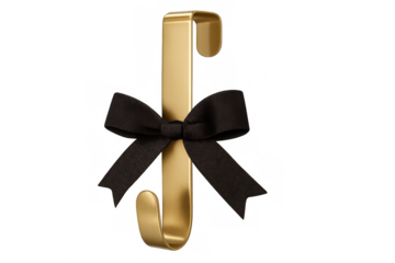 Golden metal wall hook hanging with decorative black ribbon bow against clear backdrop