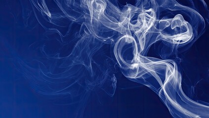Abstract smoke patterns on a deep blue background