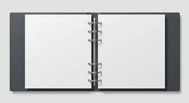 Top view of an open ring binder with blank pages. Office stationery and business planning mockup template.